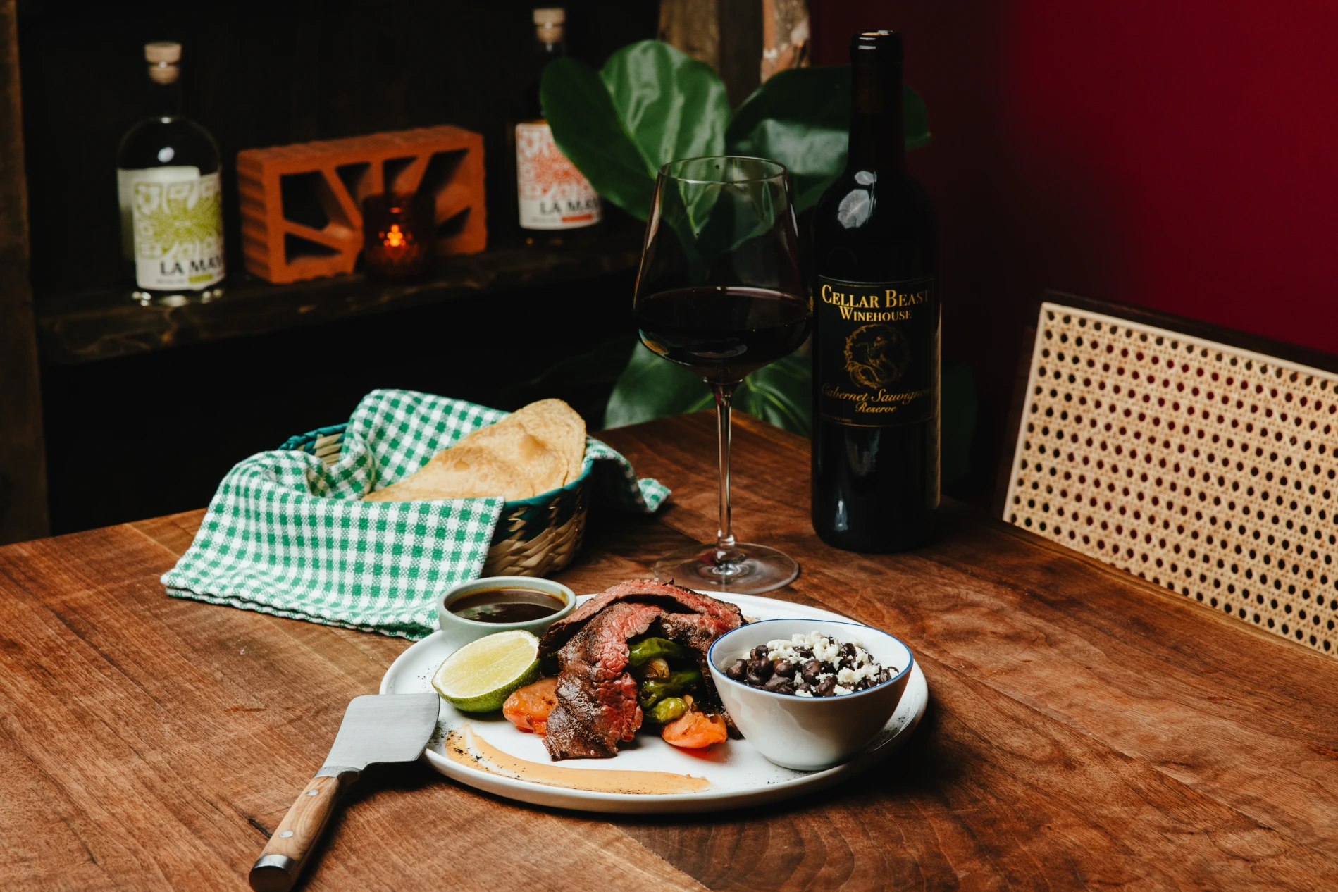 A plate of fine eatery with a great glass of wine