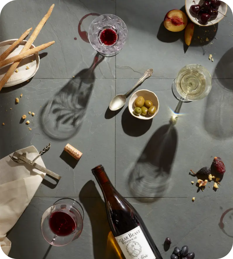 Wine Club Image of a bottle of wine and some food