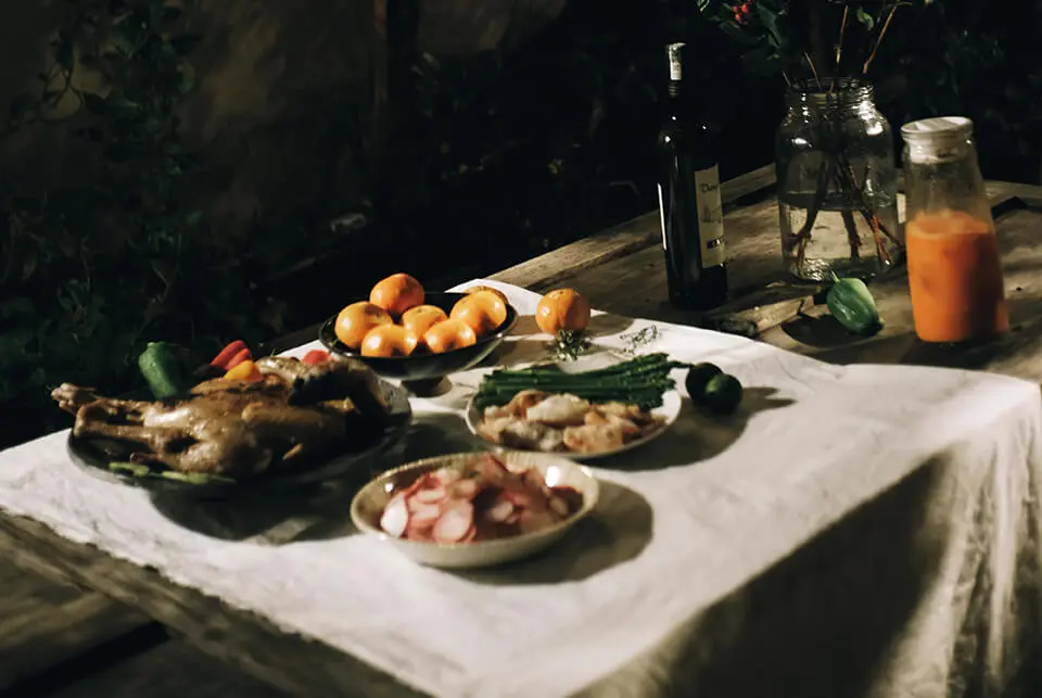 Outdoor dinner table with healthy food for eating
