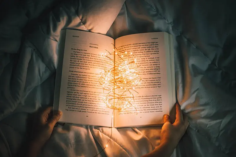 Relaxing at night with a good book to stop overthinking
