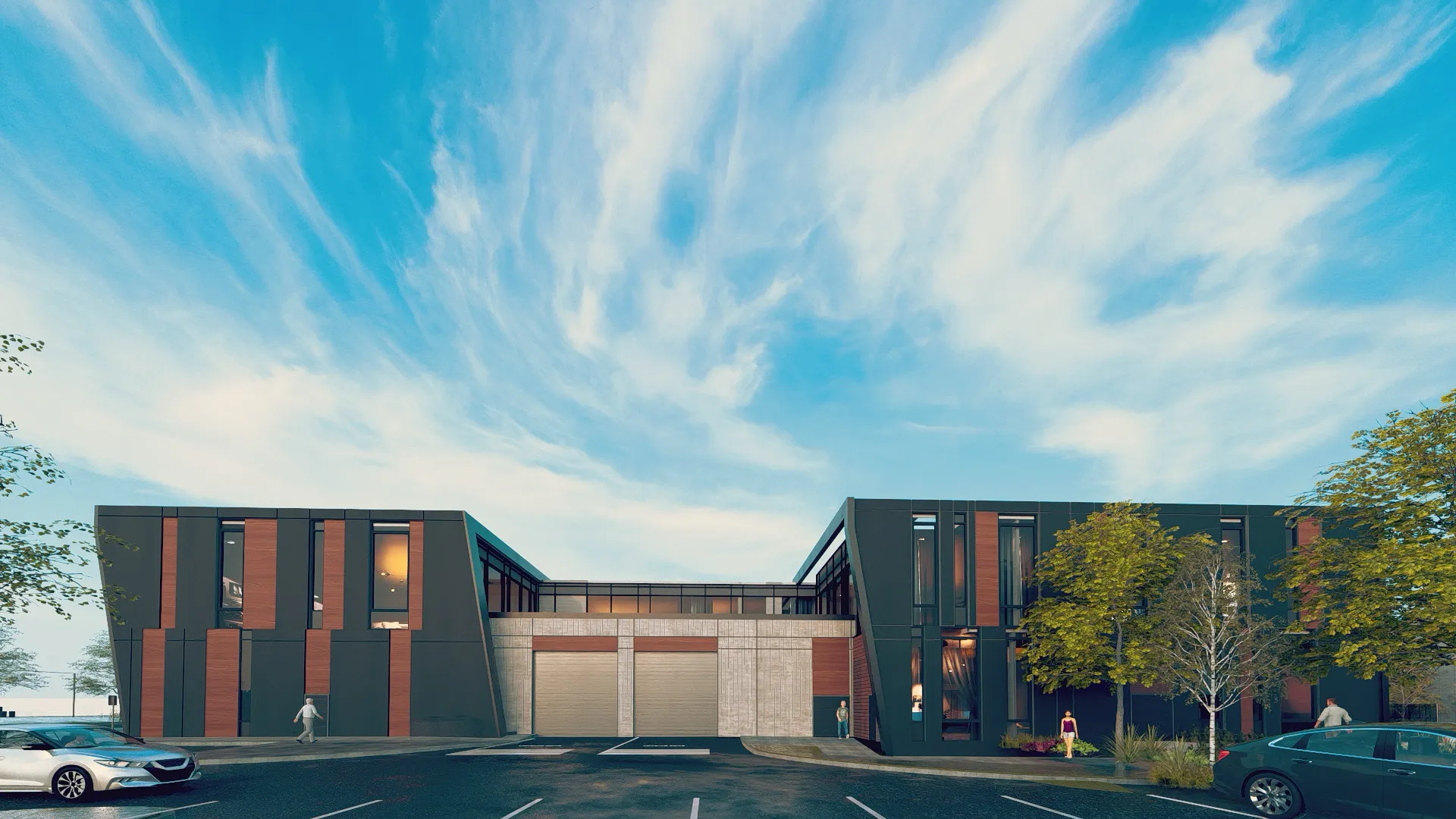 Modern two-story building with dark panels and wooden accents, surrounded by trees and parked cars under a blue sky with wispy clouds.