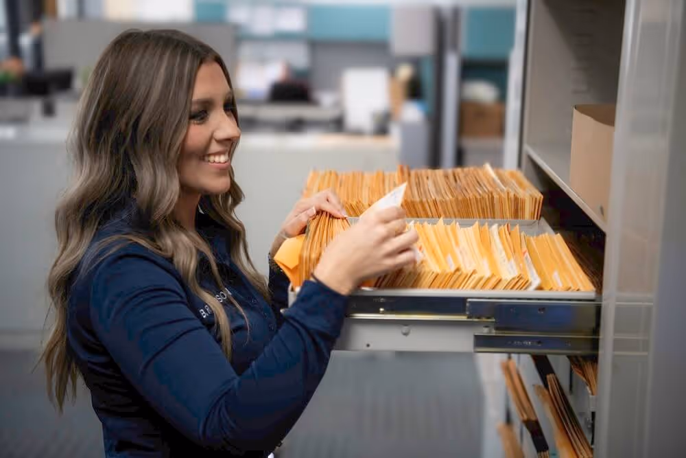 female worker sorting the files