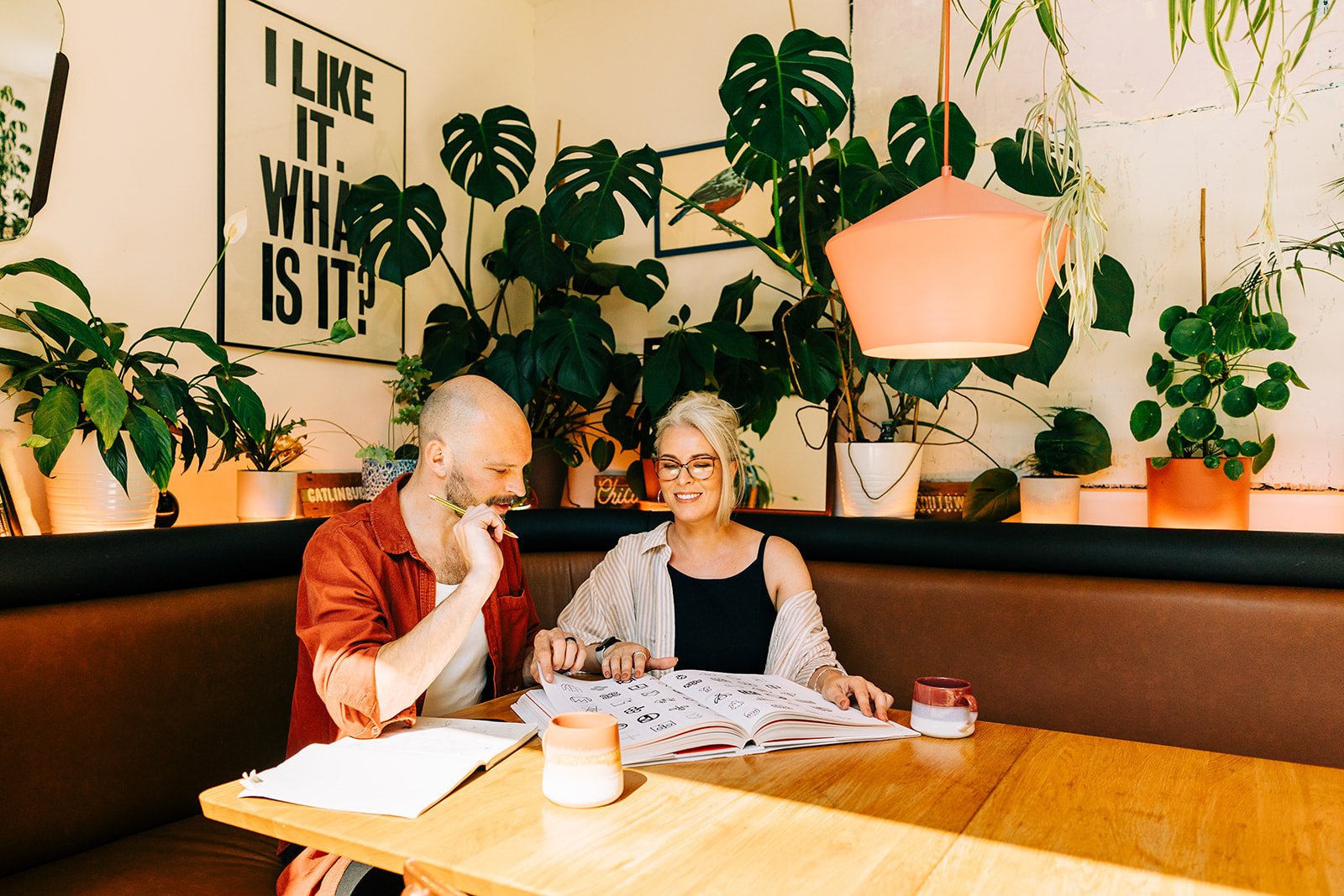 Seth and Jess Matisak working together at a table in the Tokyo Calm studio