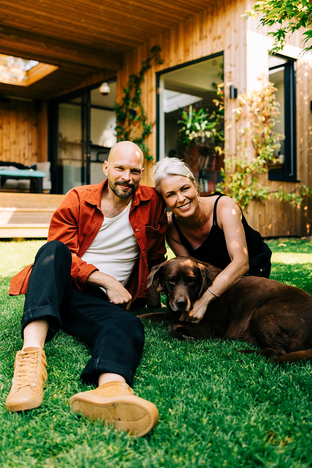 Jess and Seth Matisak in the garden with their dog