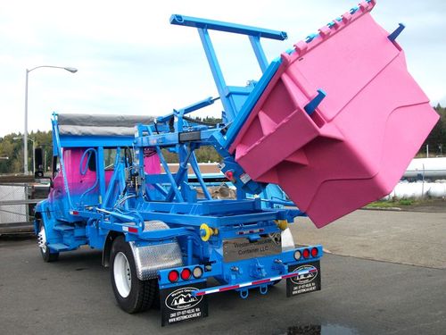 Western Cascade Container Stellar Container Carrier ECCR shown subframed for small Hooklift on Stellar Hooklift with custom features and Hedstrom Poly Front Load container in custom colors