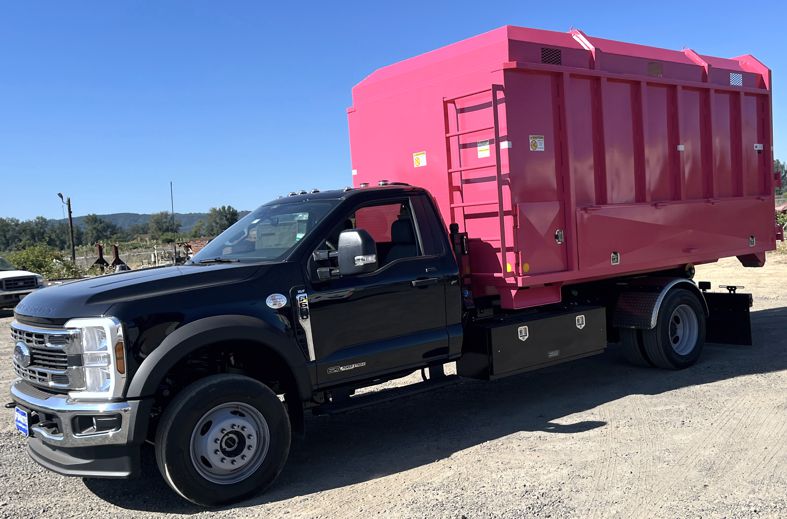 Western Cascade Container Chip Box in pink for Hooklift shown with optional features shown on Stellar Flex Hooklift