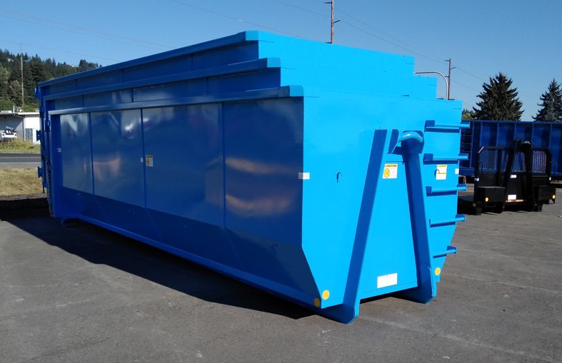 Western Cascade Container blue stack of Nestable semi-tub boxes for small Hooklift secured for shipping