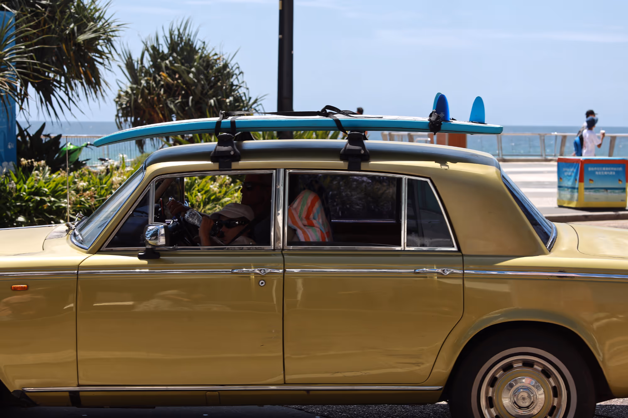 Rolls Royce with a surf board on top Surfers Paradise Esplanade