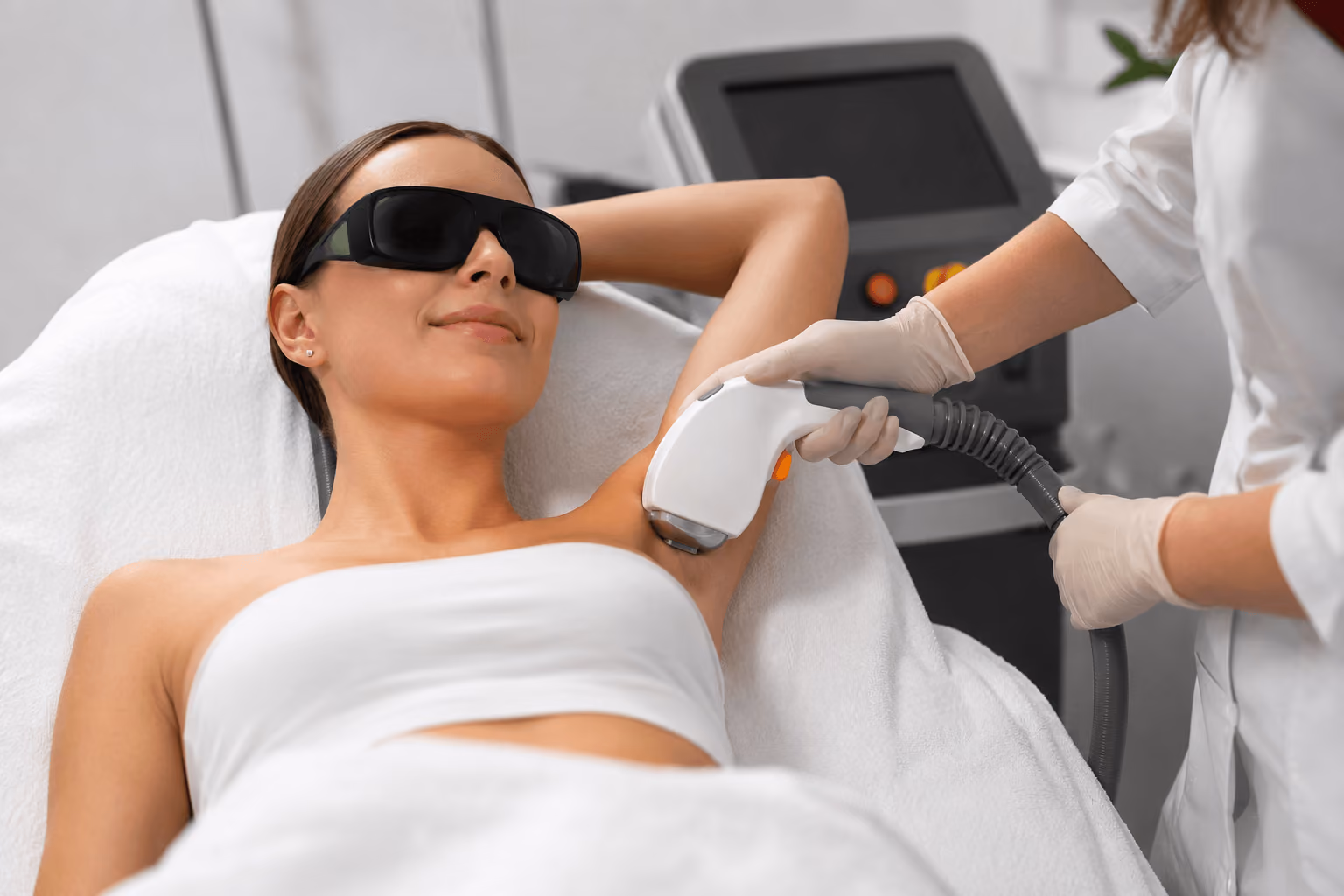 Patient receiving Soprano ICE Platinum laser hair removal treatment on the legs at a medical spa in Chicago, Illinois.
