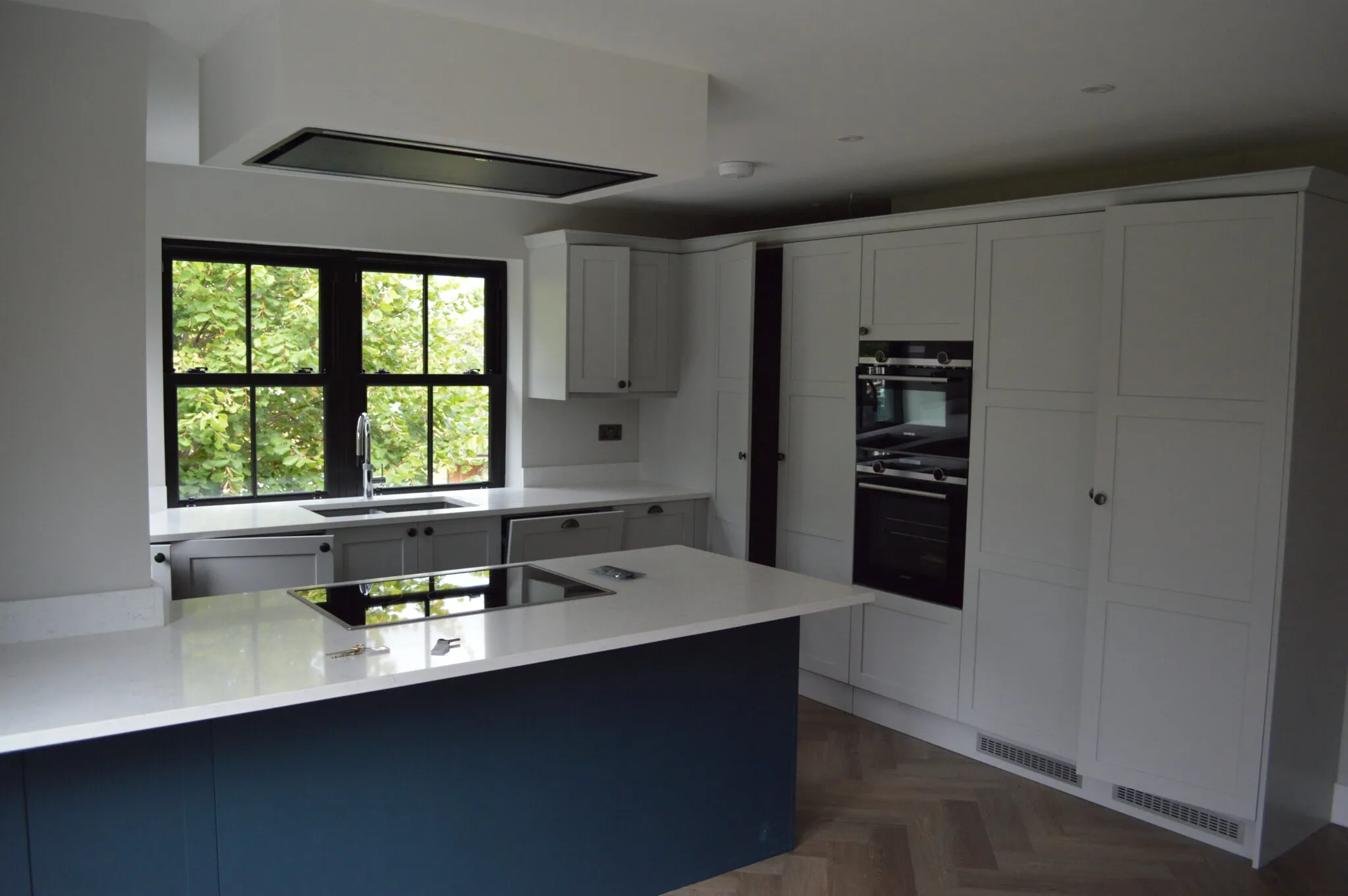a kitchen with a large island and a window