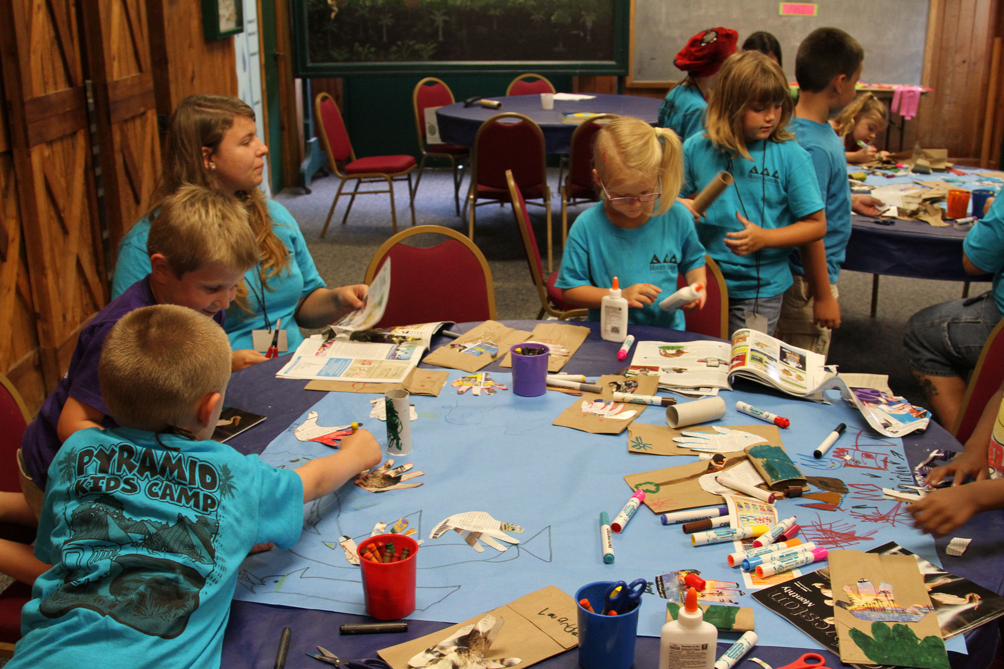 A child participating in the Learn Wild! Home School program looks through a microscope