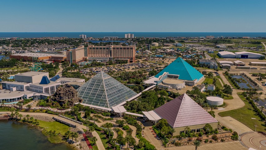 Moody Gardens logo on a blue to cyan gradient, Galveston, Texas