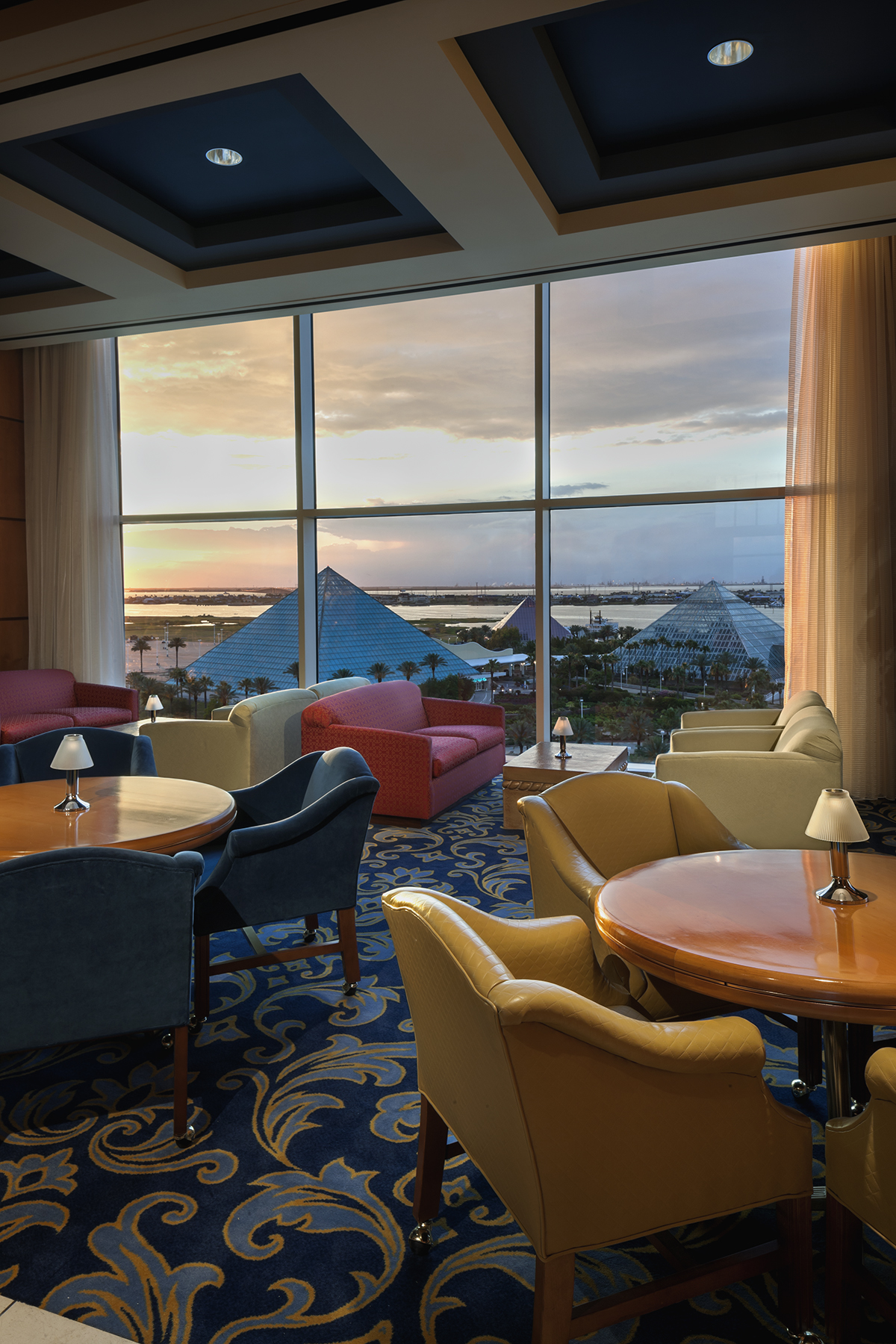 Shearn's Lounge seating at sunset with a view of a Moody Gardens pyramid