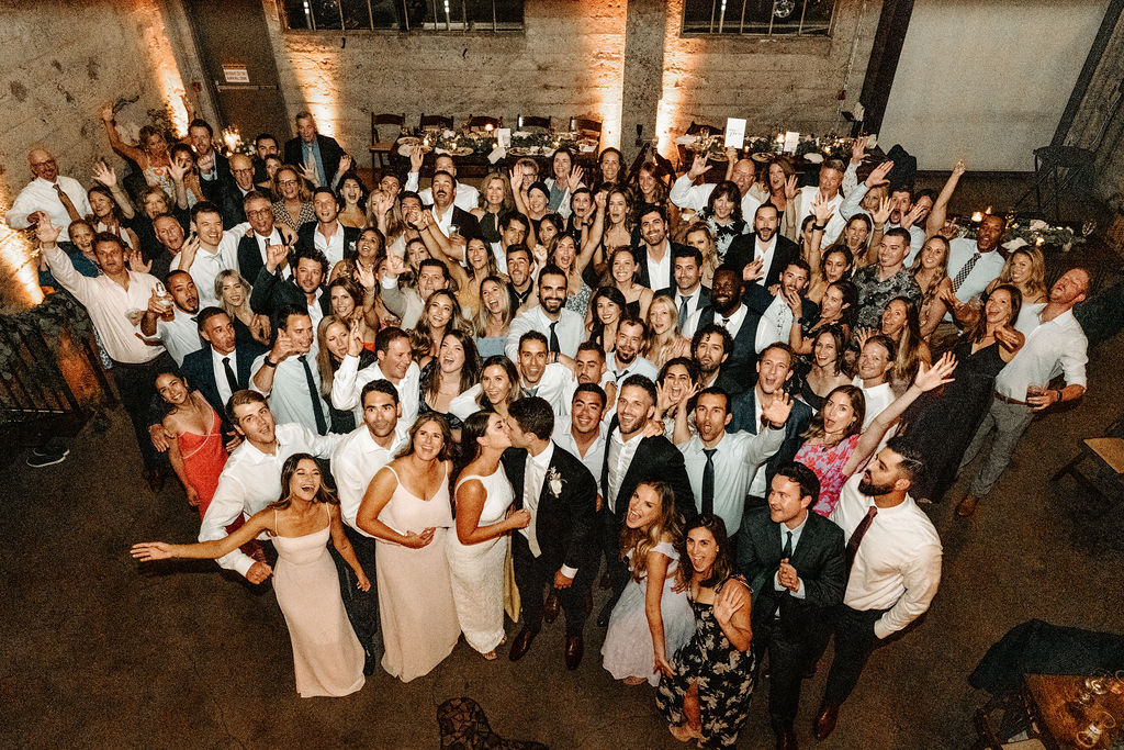 Wedding reception guests celebrating with live entertainment