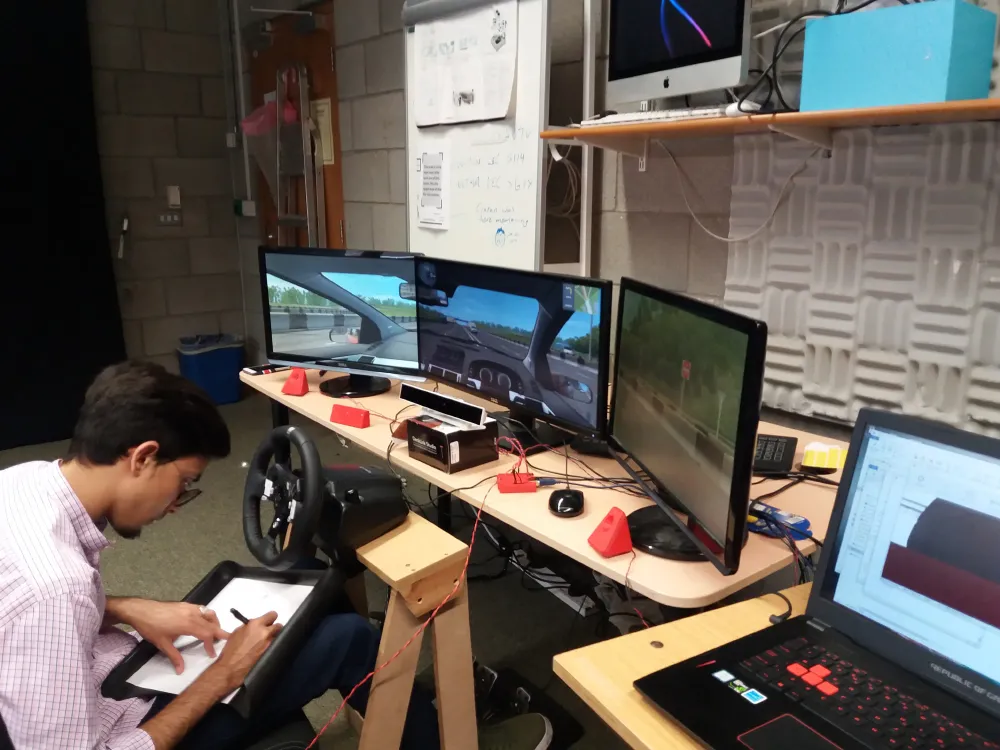 person taking a survey after using a rough driving sim