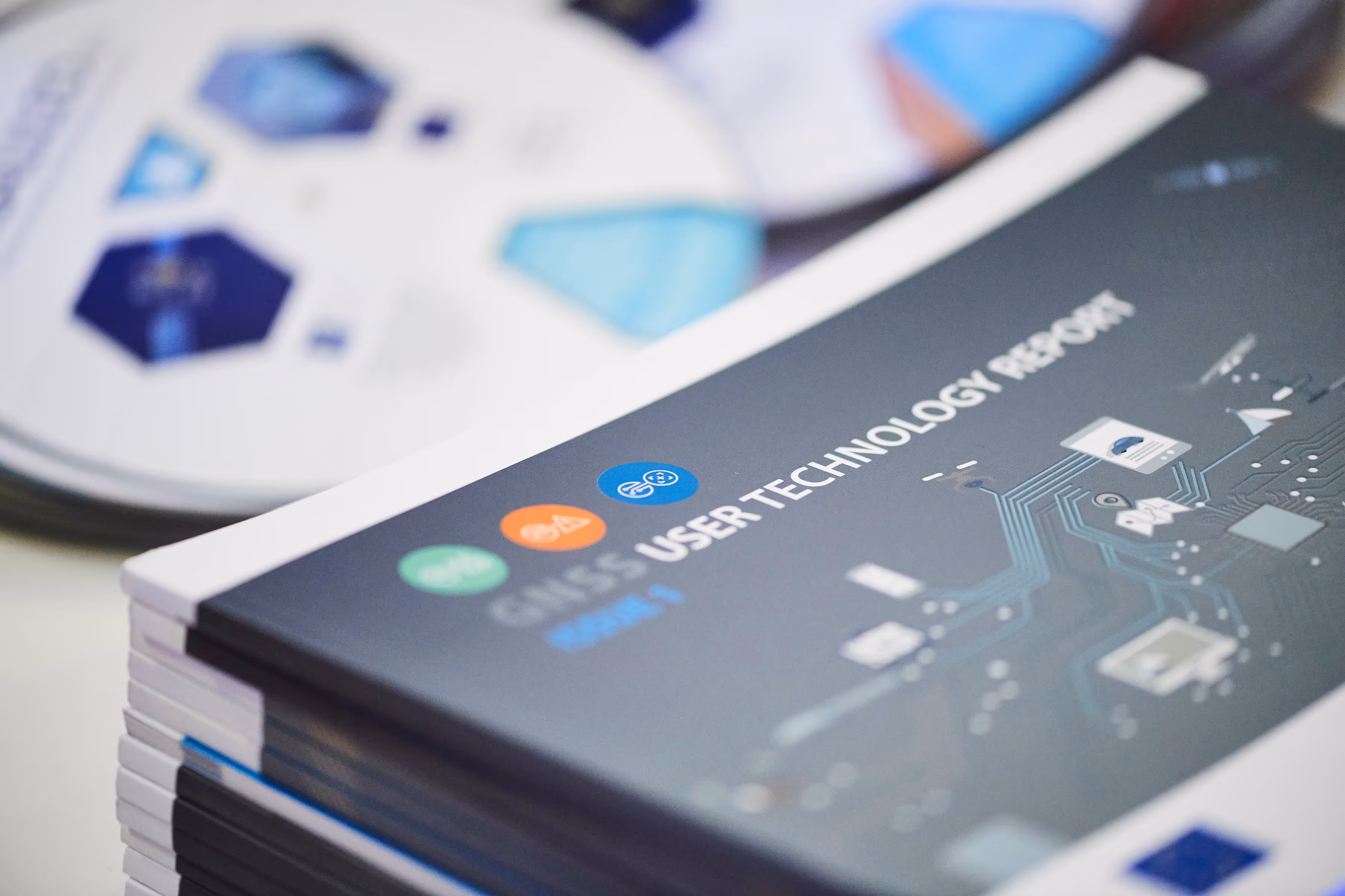 a circular leaflet alongside a technology booklet