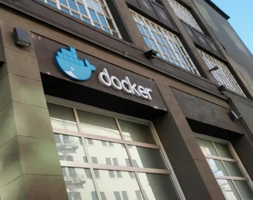 Exterior view of a building with Docker logo and name above large ground-floor windows.