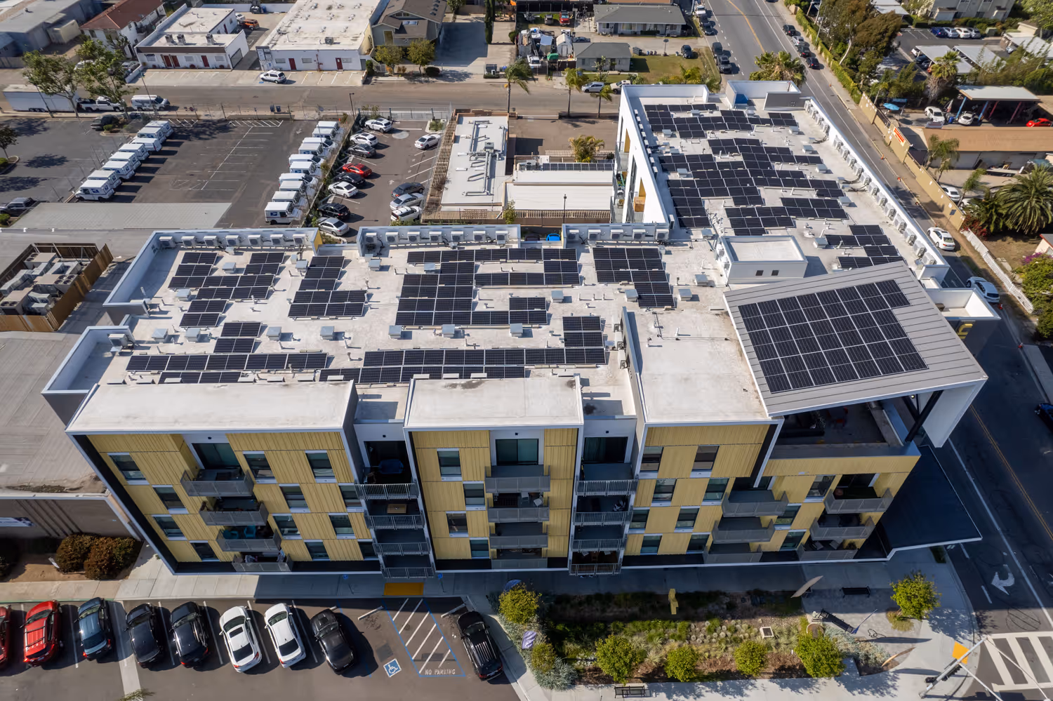 Solar panels installed on top of a multi-family apartment complex in San Diego, part of a 92.22kW system by TENCO SOLAR.