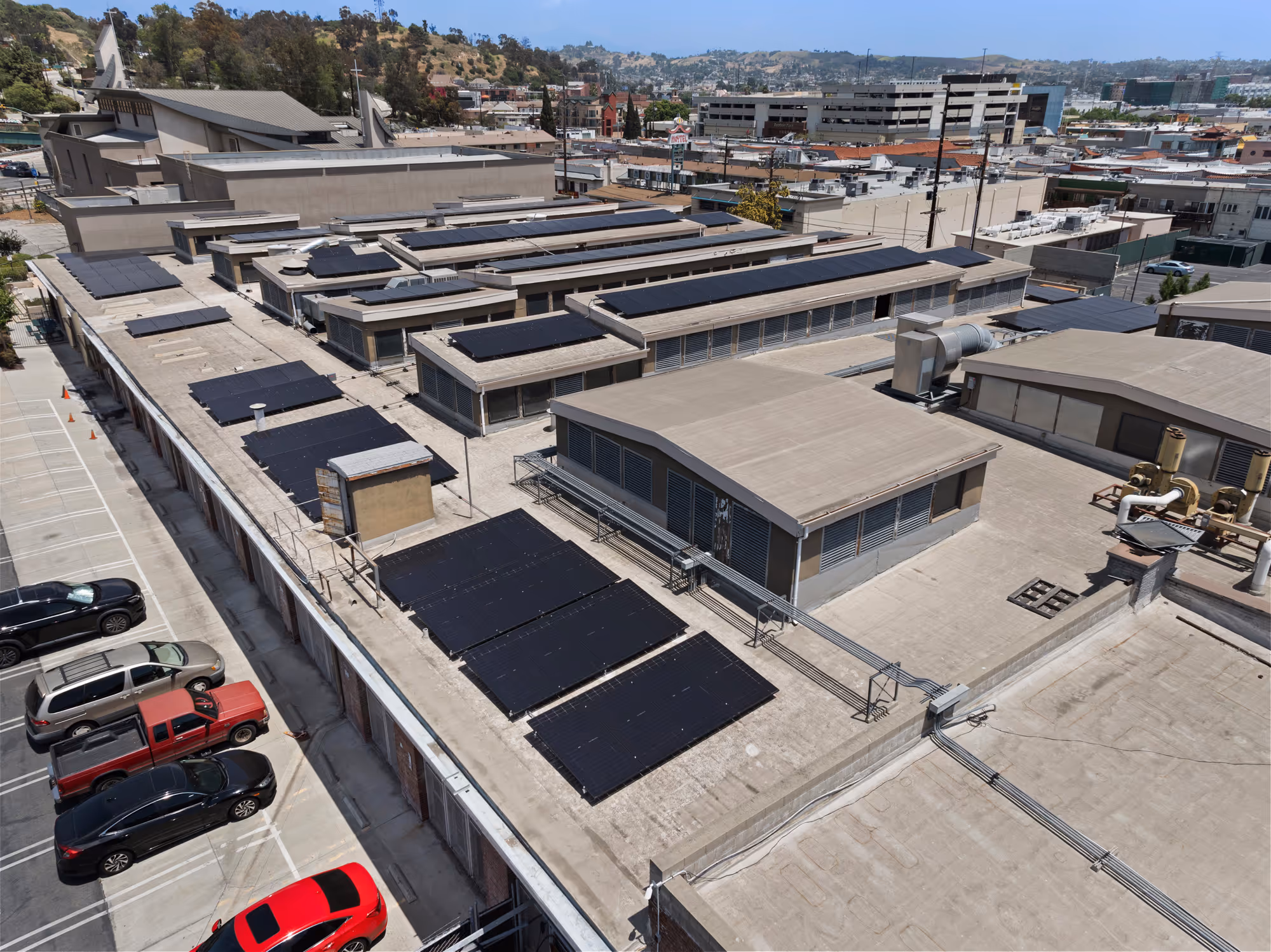Drone view of a 232.1 kW rooftop commercial solar installation in California.
