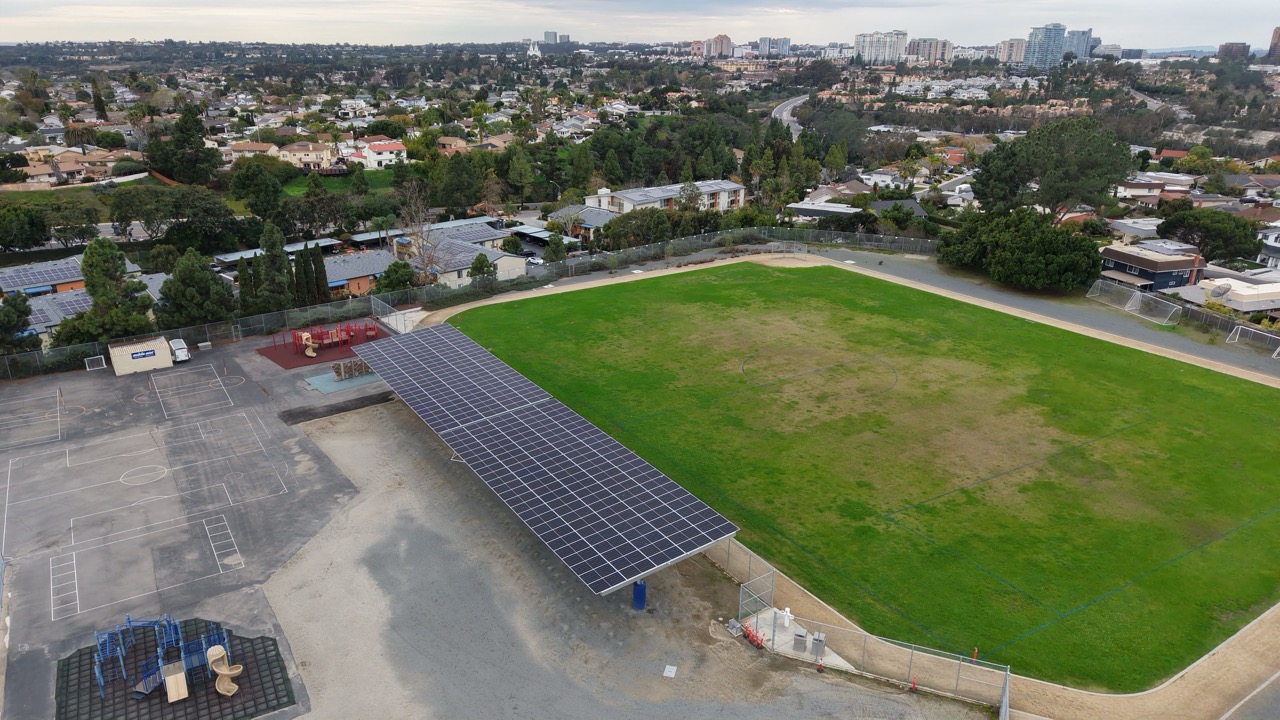 Commercial solar carport system installed at Curie Elementary School supporting SDUSD renewable energy initiatives.