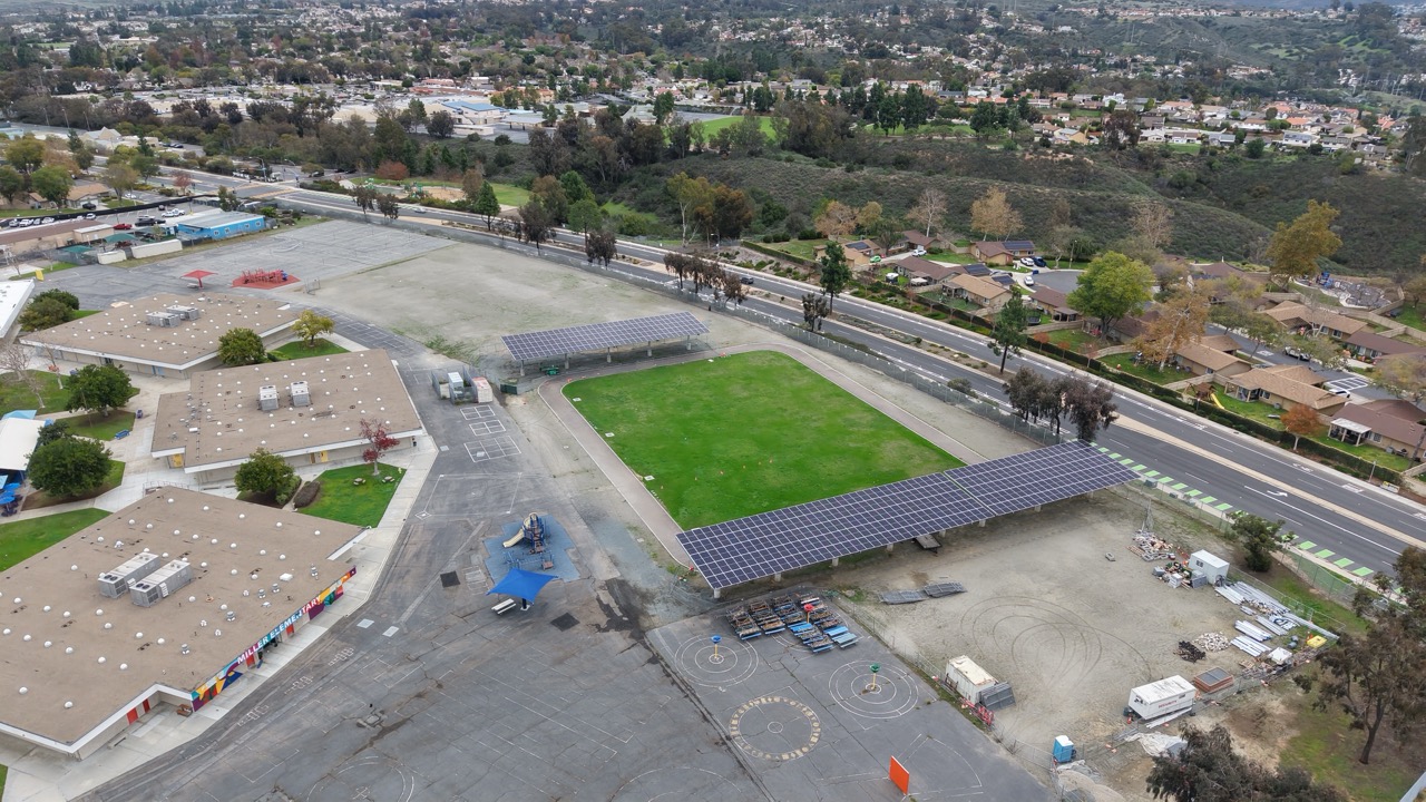 Drone aerial image of solar carport installation at Miller Elementary School, a commercial solar for schools project in the SDG&E region.