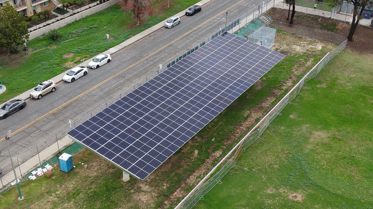 Aerial drone view of Pendleton Elementary School solar installation delivering clean energy through a solar carport system.