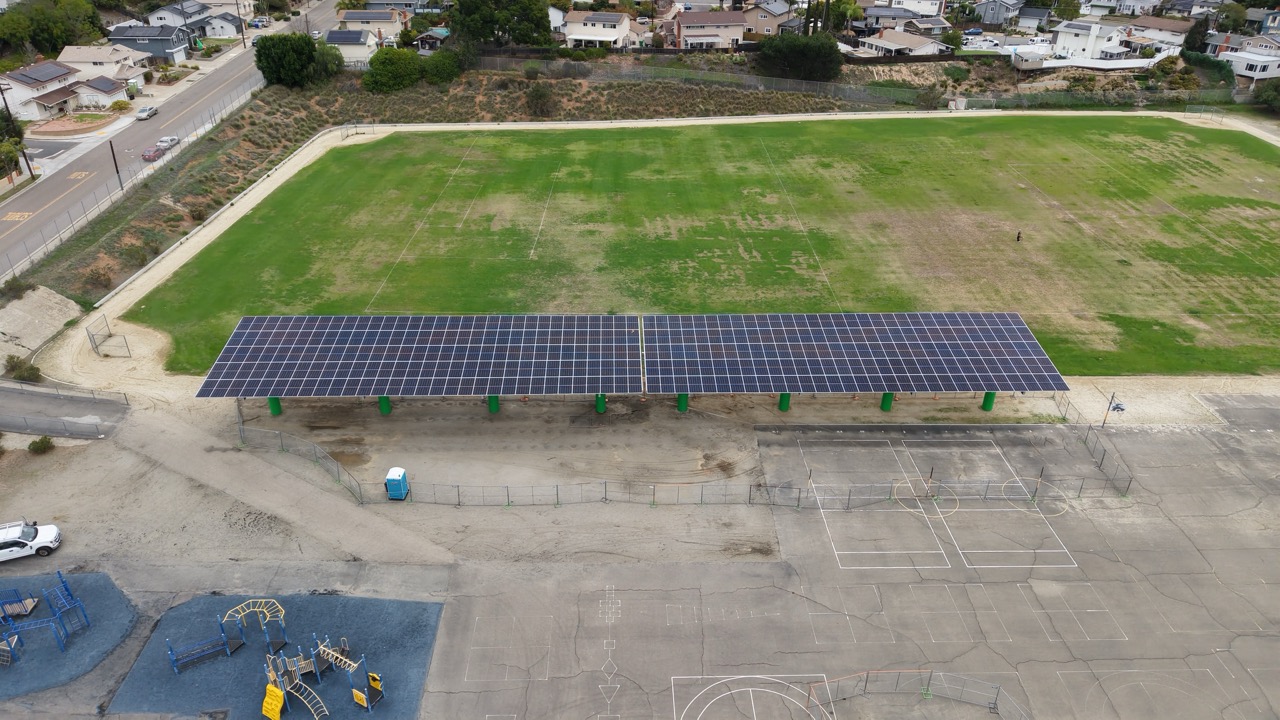 Drone aerial view of solar carport installation at Gage Elementary School, a DSA solar project supporting SDUSD commercial solar in the SDG&E region.