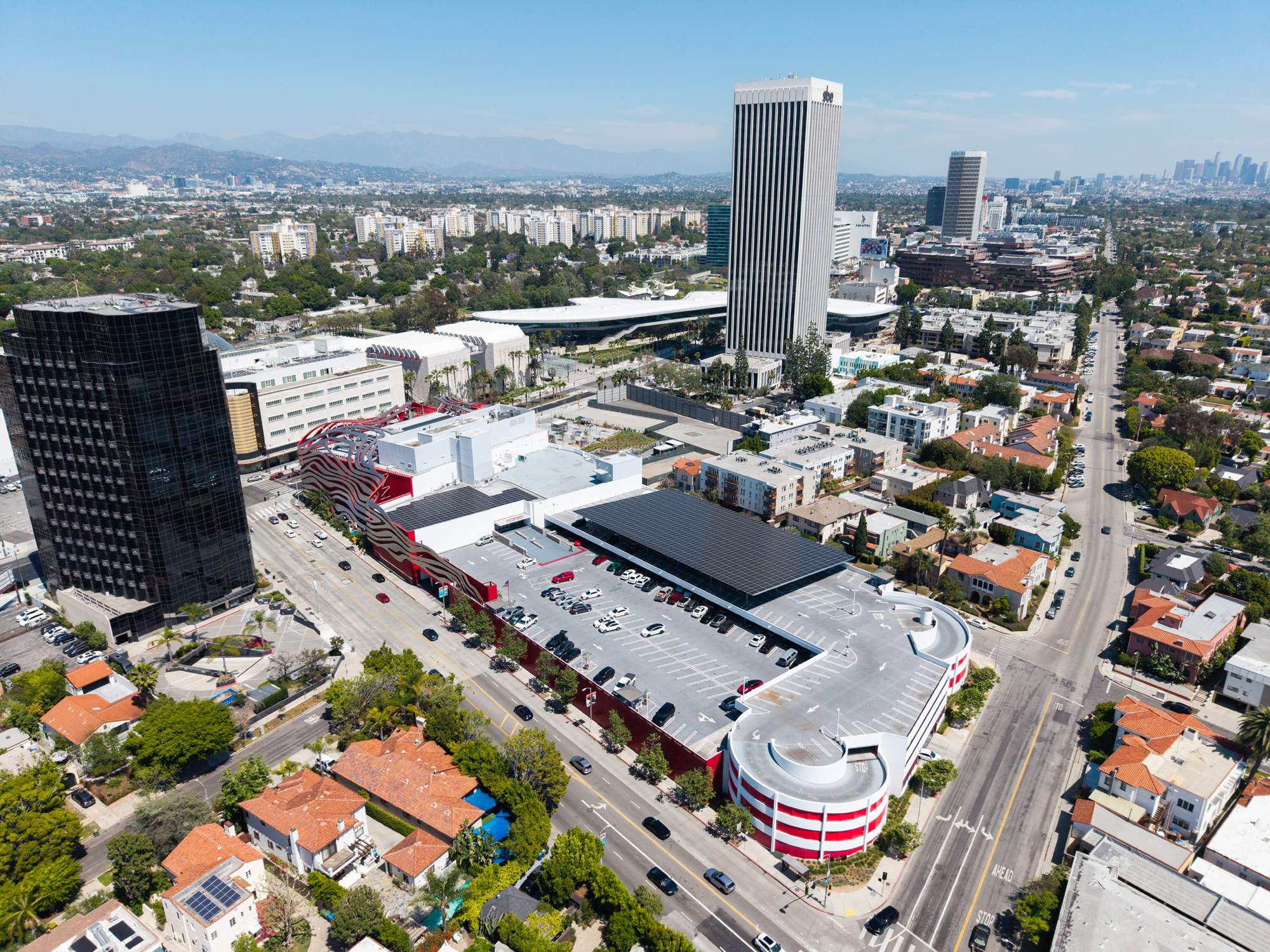 Petersen Automotive Museum with rooftop Solar System and Commercial Solar canopy visible behind the façade as part of a solar PV installation.