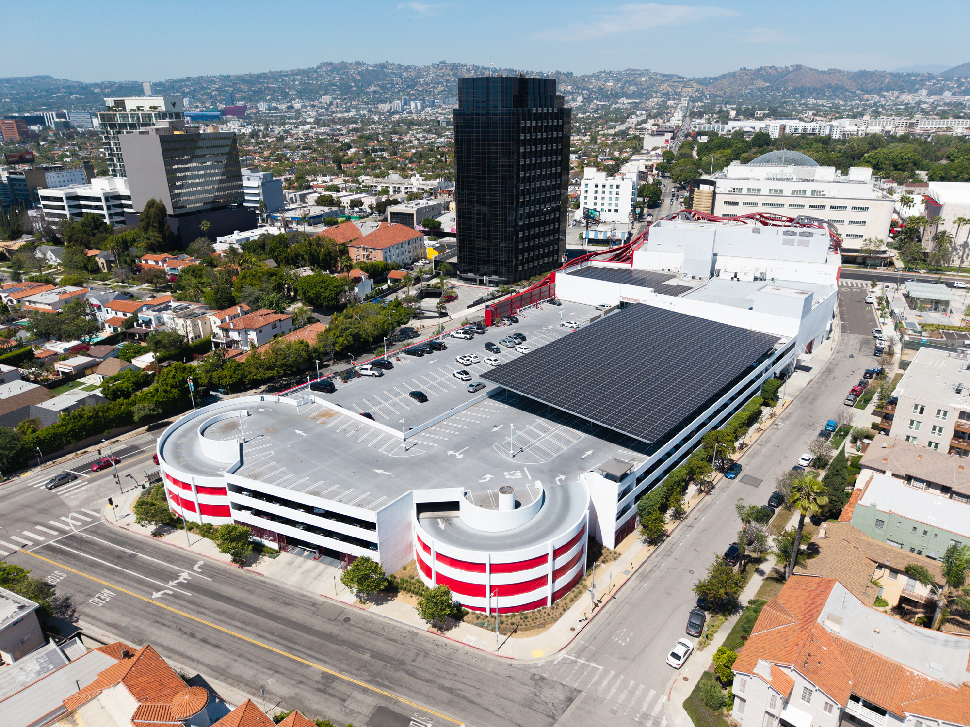 Elevated angle of Petersen Solar System showing Commercial Solar carport and solar PV panels on the parking structure.