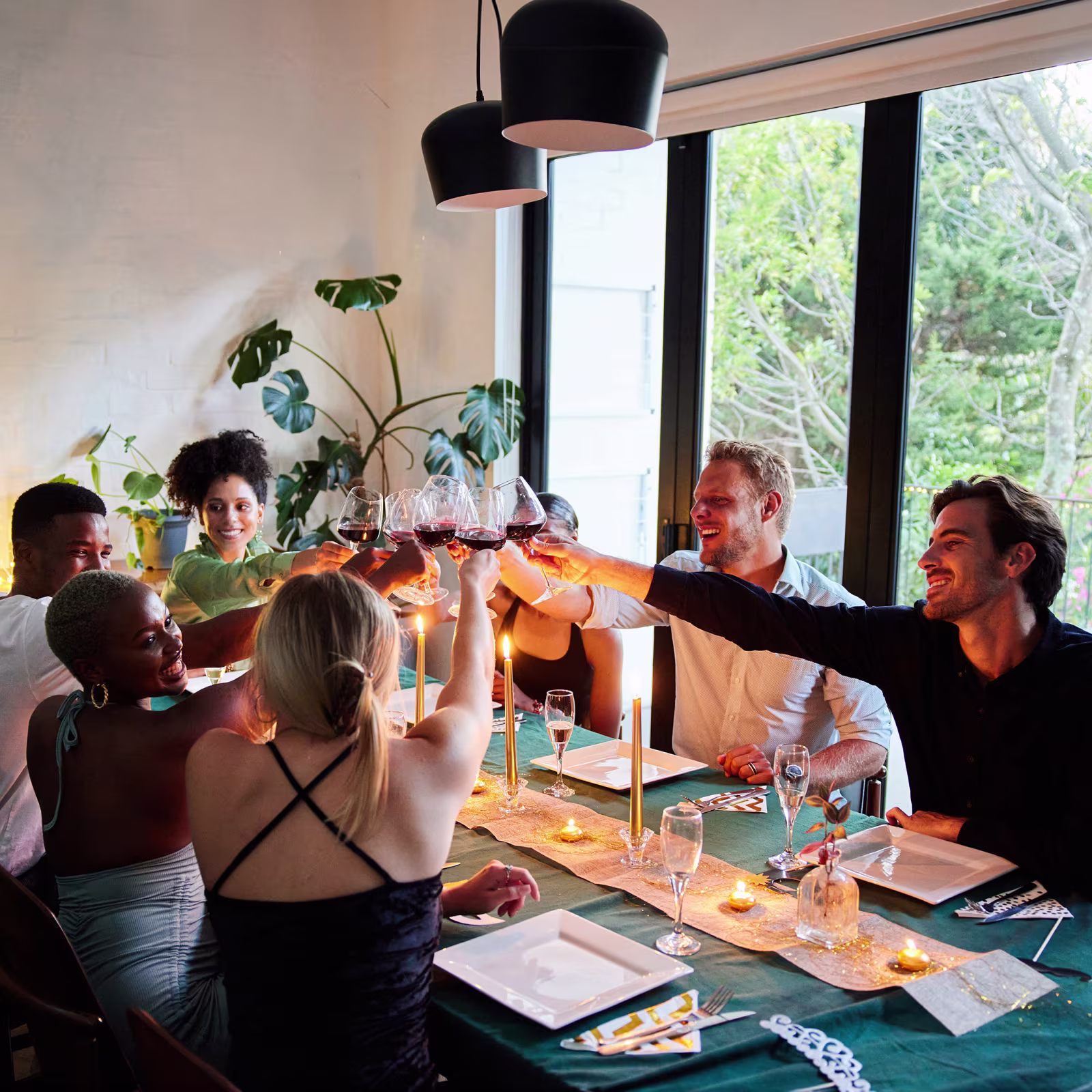 friends gathering for a dinner party at a swimply homes listing for rent by the hour