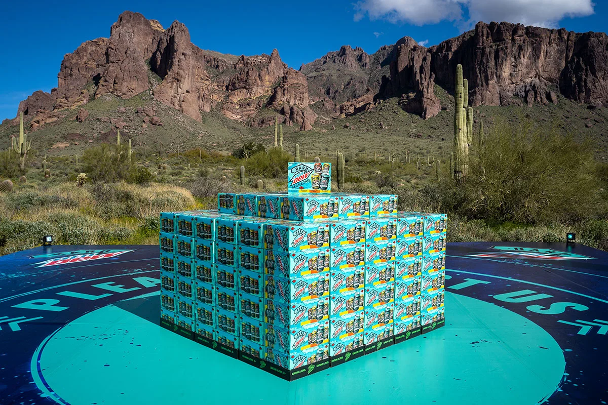 Imprint stacked Hard Mountain Dew cases on the landing pad for the Alien Abduction activation