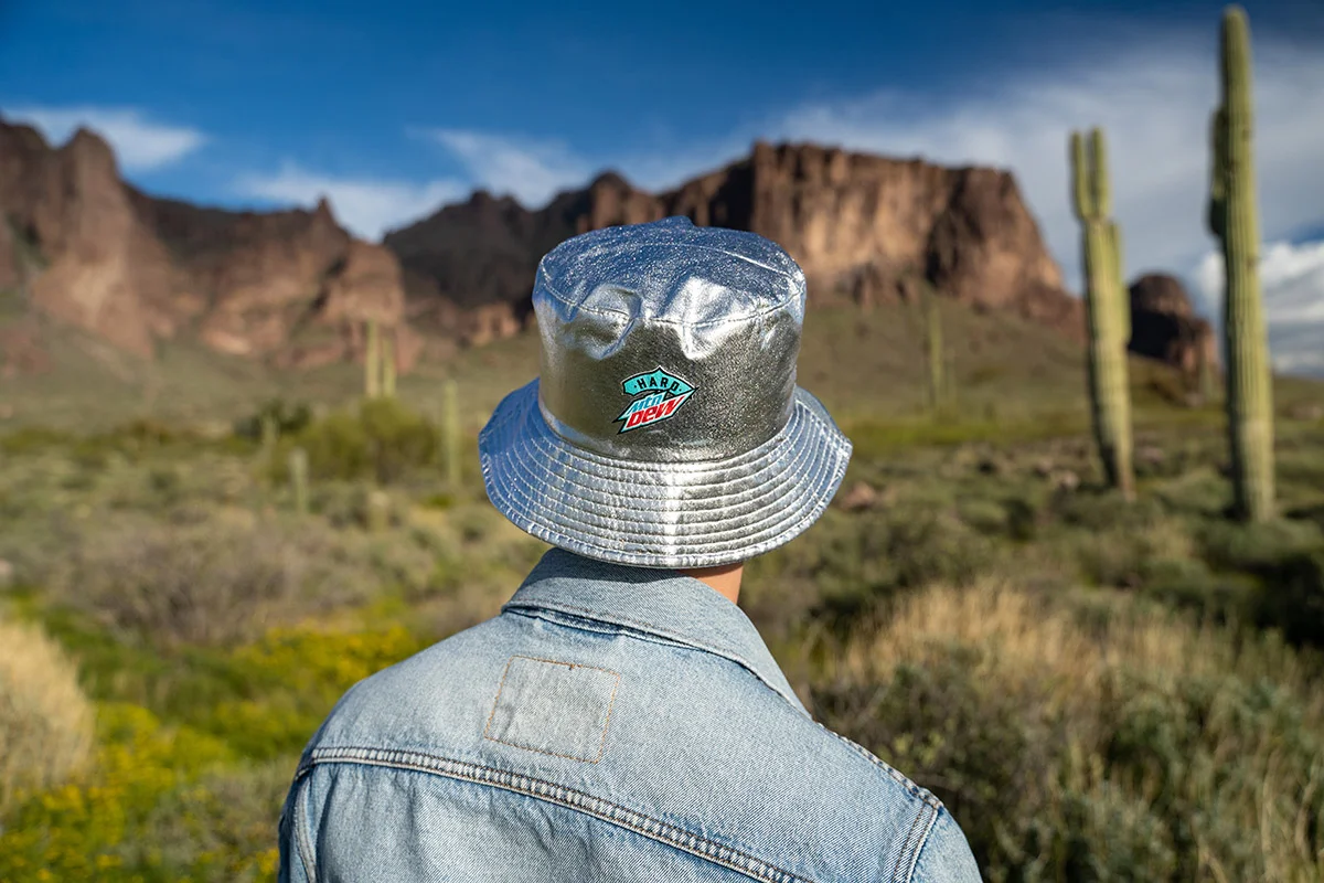 A guest models Imprint's branded merch at the Hard Mountain Dew Alien Abduction activation