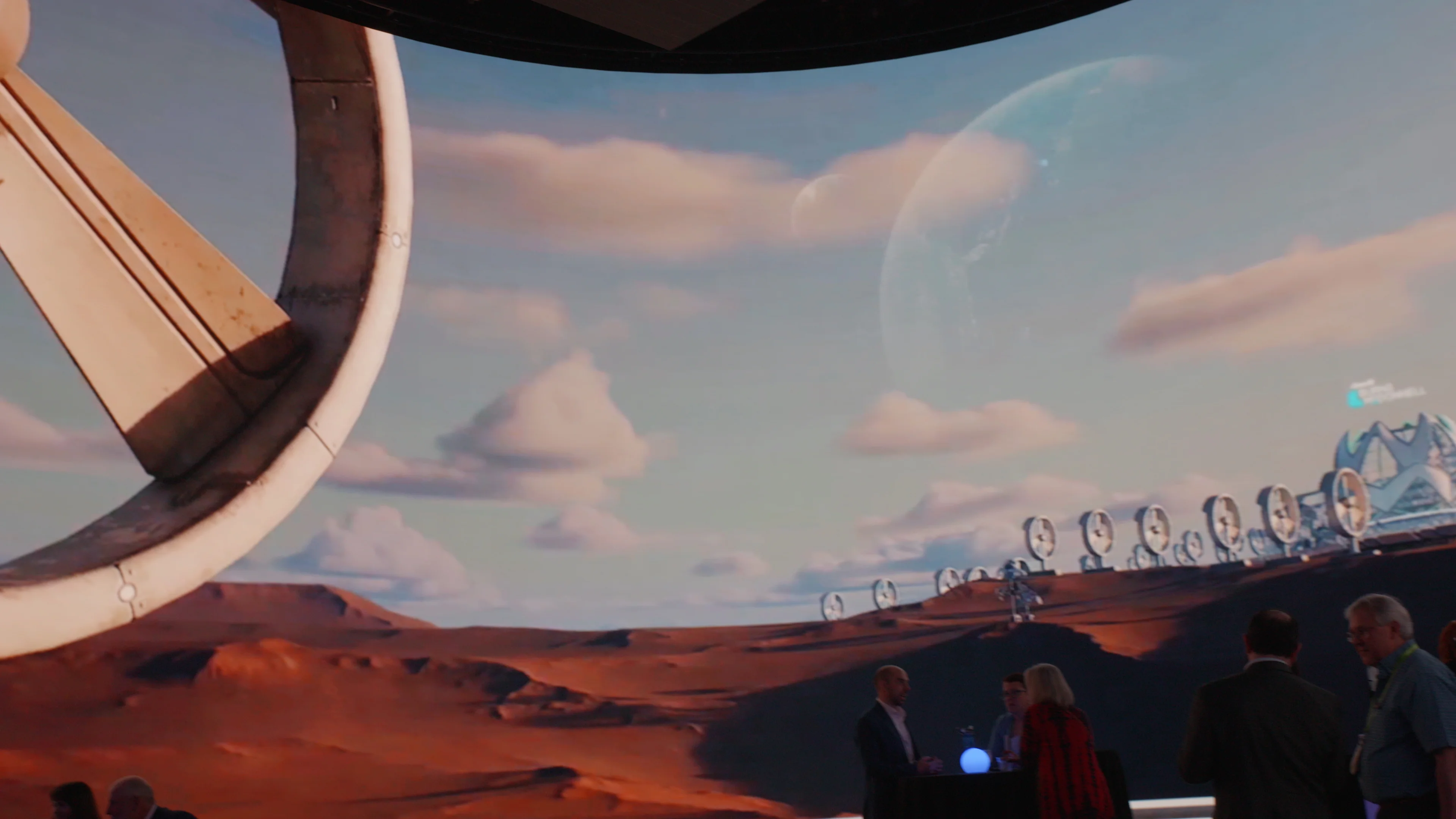 Guests view Imprint's Mars-like immersive screen environment at the Burns McDonnell activation