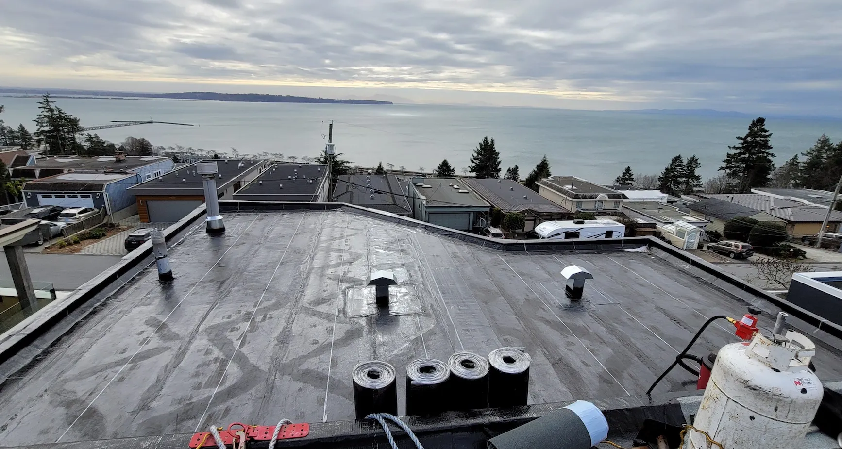 Flat roof repair in progress in Vancouver by Pro Torch Roofing