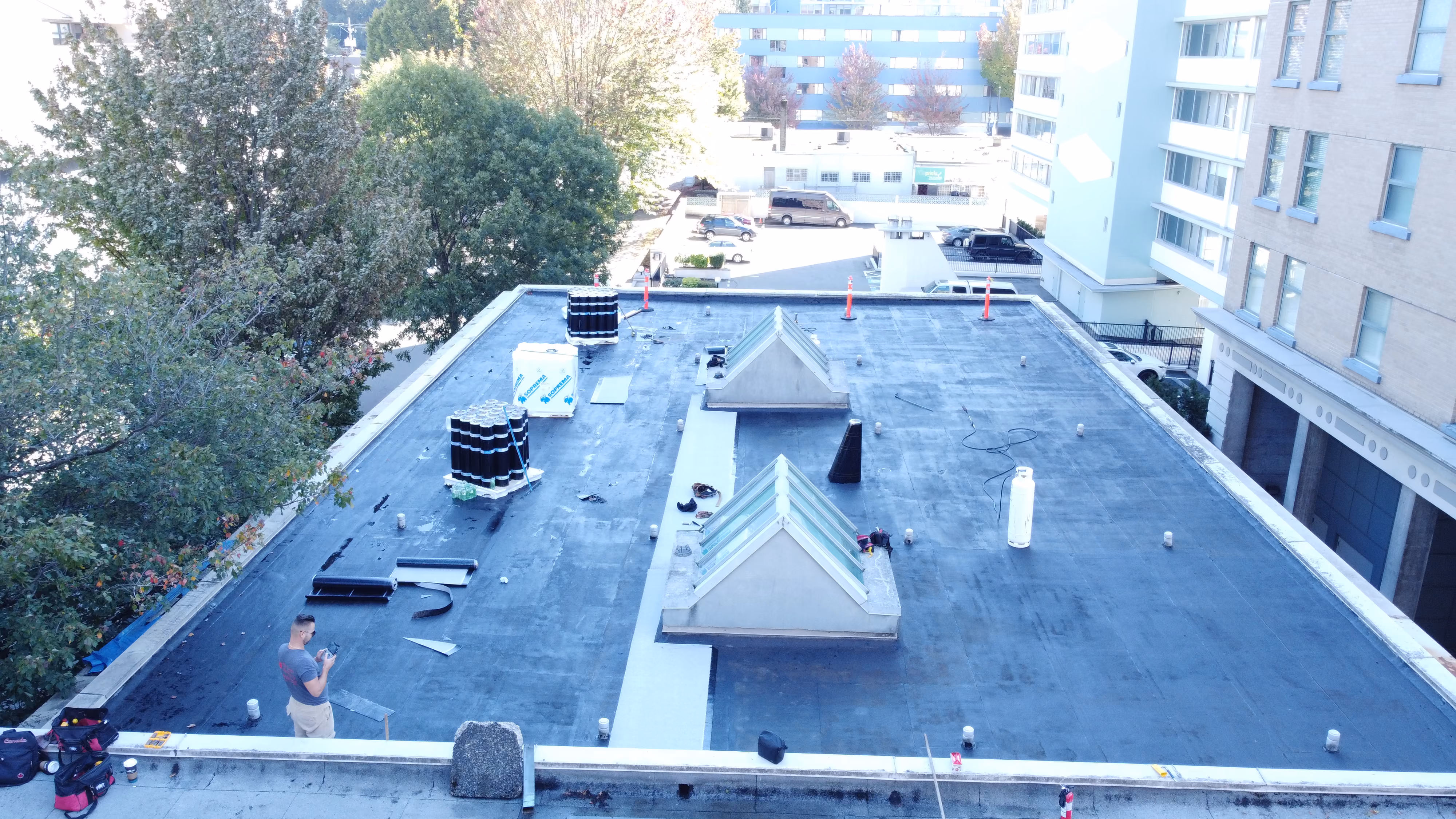 Drone view of a flat torch-on roof under construction in Vancouver BC