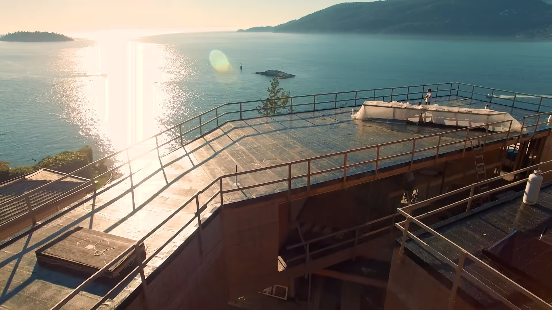 White Cliff, West Vancouver — oceanfront torch-on roof and custom metal at sunset