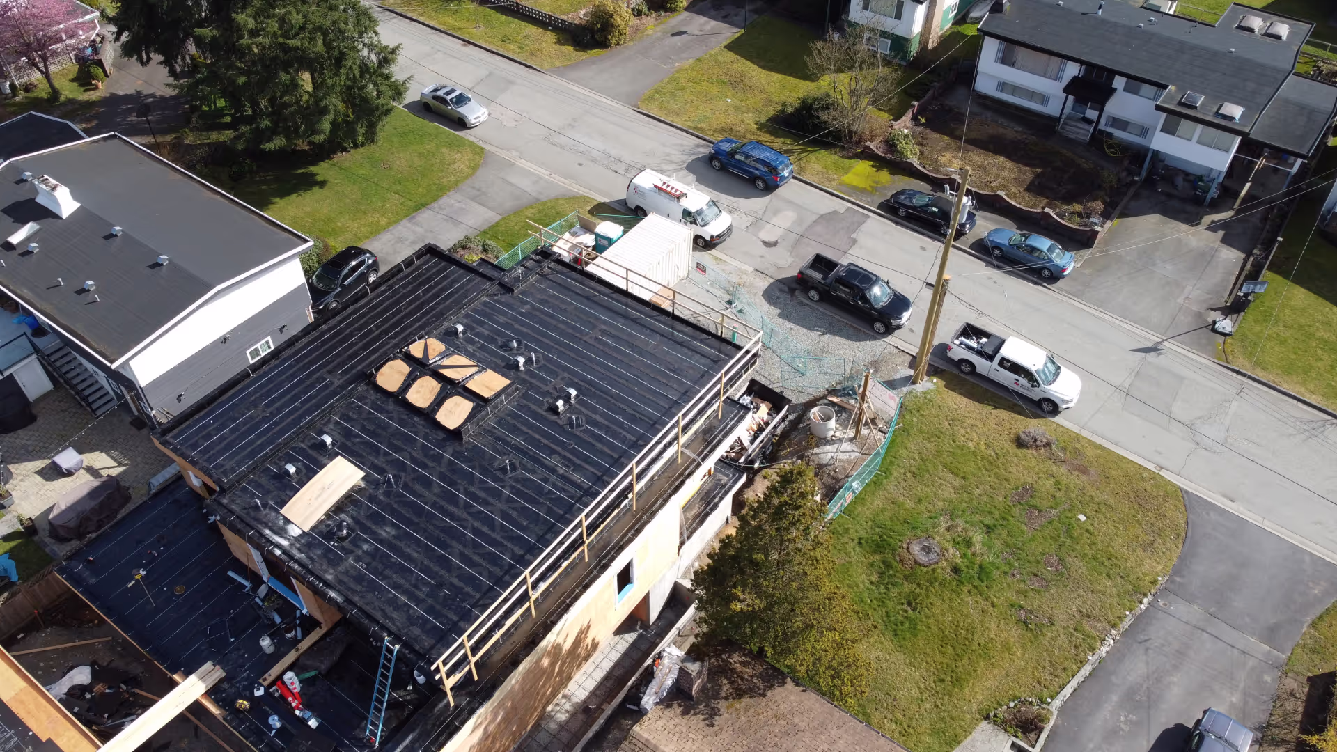 Coquitlam flat roof replacement — finished torch-on roof, aerial