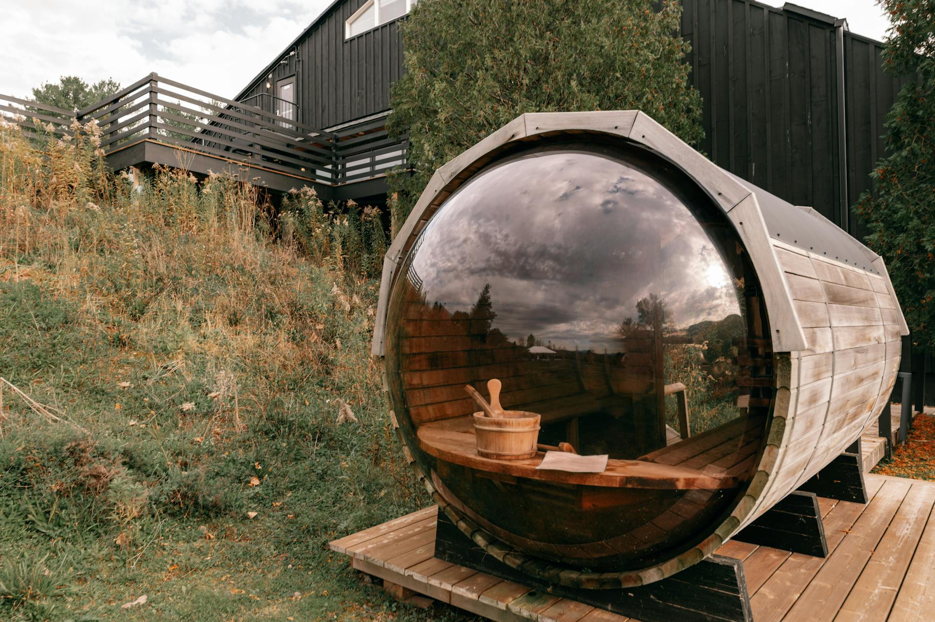 Outdoor sauna with rounded window