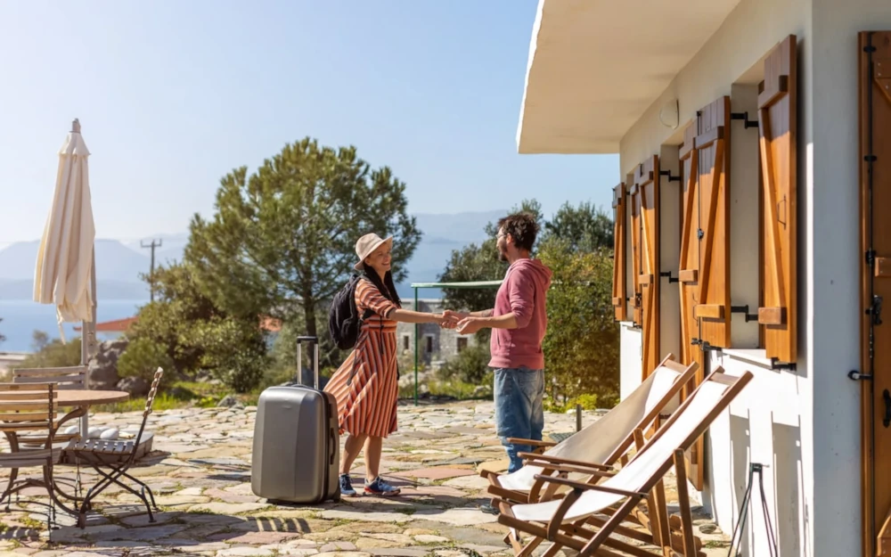 A group of people walking into a beautiful vacation rental.