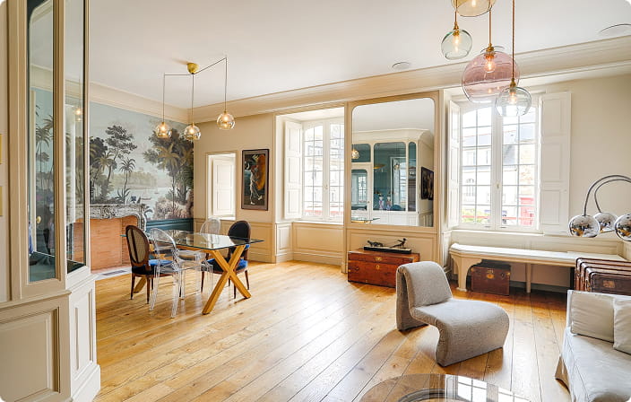 Elegant Parisian apartment interior with panoramic mural, period features and contemporary furniture