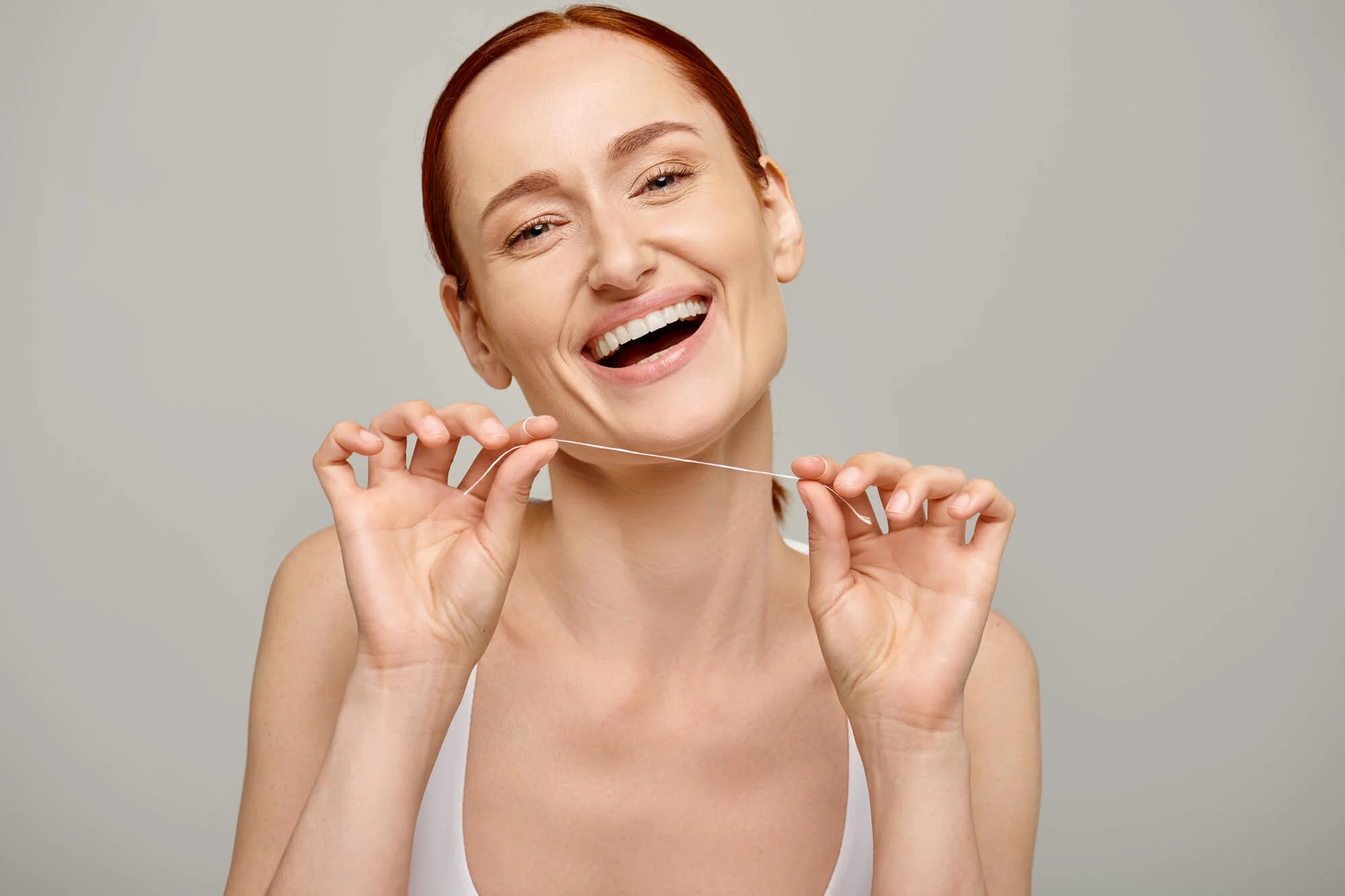 flossing before General Dentistry Services in Jensen Beach