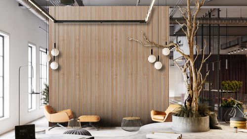 A picture of a living room that is mainly burgundy in colour with an armchair in the foreground and a bookshelf in the background