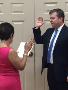 trauss Troy Shareholder Joesph Braun being sworn in as Solicitor in Loveland by Loveland Vice Mayor Angela Settell.