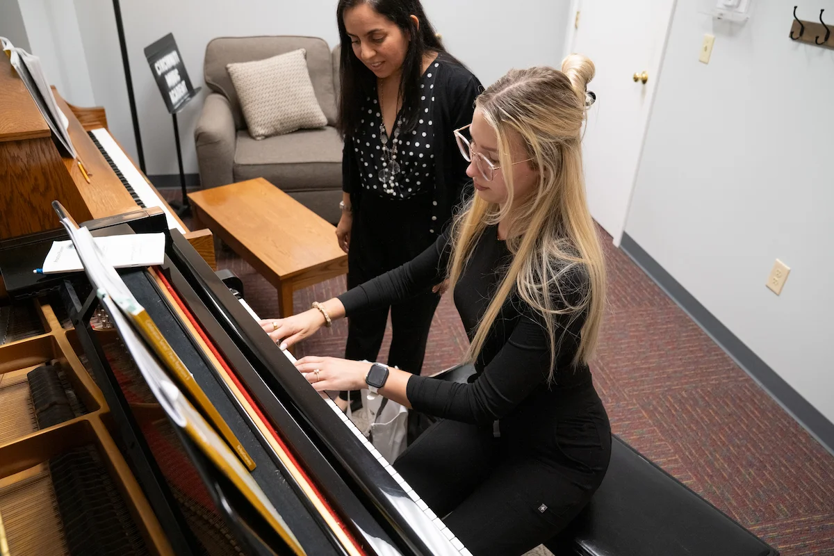 Adult student working one-on-one with piano instructor at Cincinnati Music Academy.