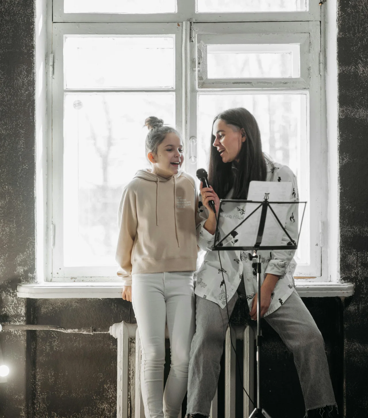 Voice instructor singing with a young student during a private voice lesson at Cincinnati Music Academy.