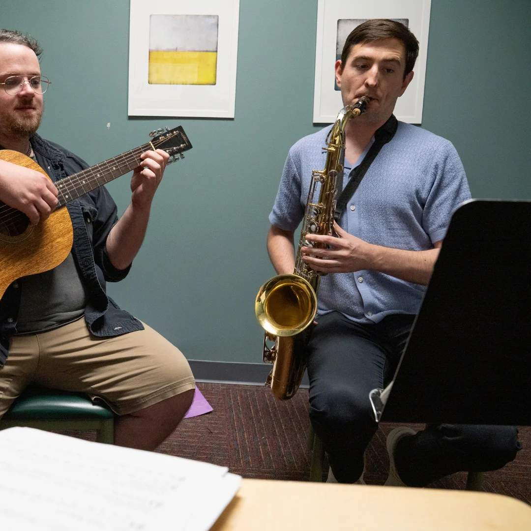 A CMA woodwinds instructor guiding a student through a saxophone lesson. Captures CMA’s focus on personal instruction, tone development, and ensemble collaboration within the Woodwinds Program.