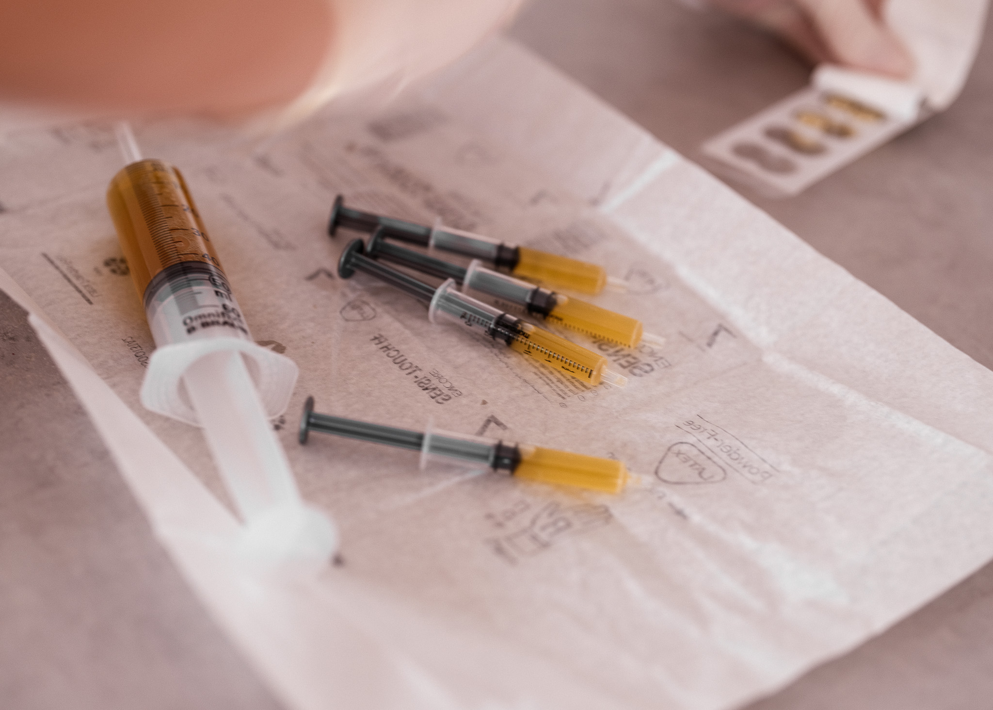 Filled PRP syringes laid out on a sterile field