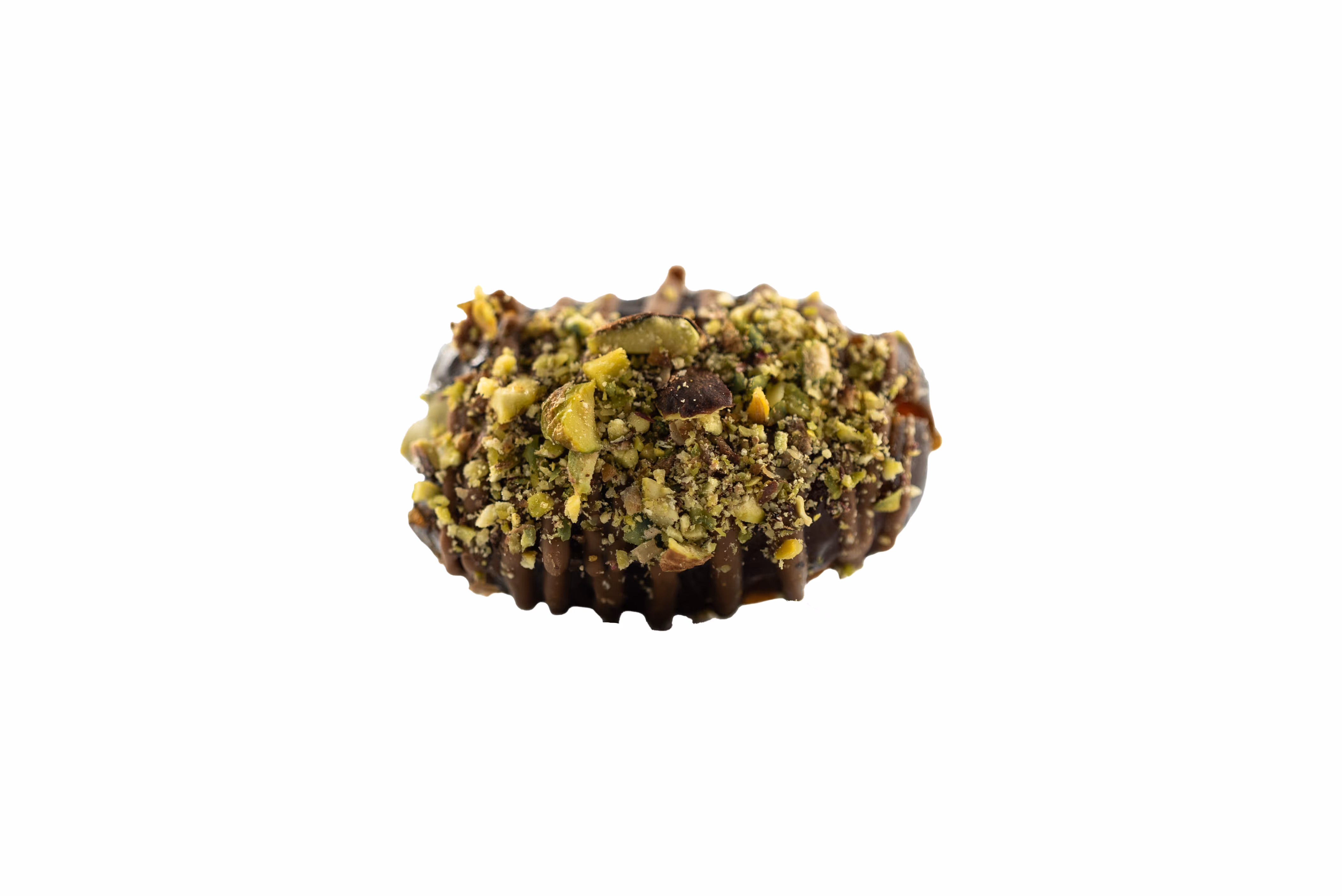 Chocolate confection topped with crushed pistachio nuts on a white background.