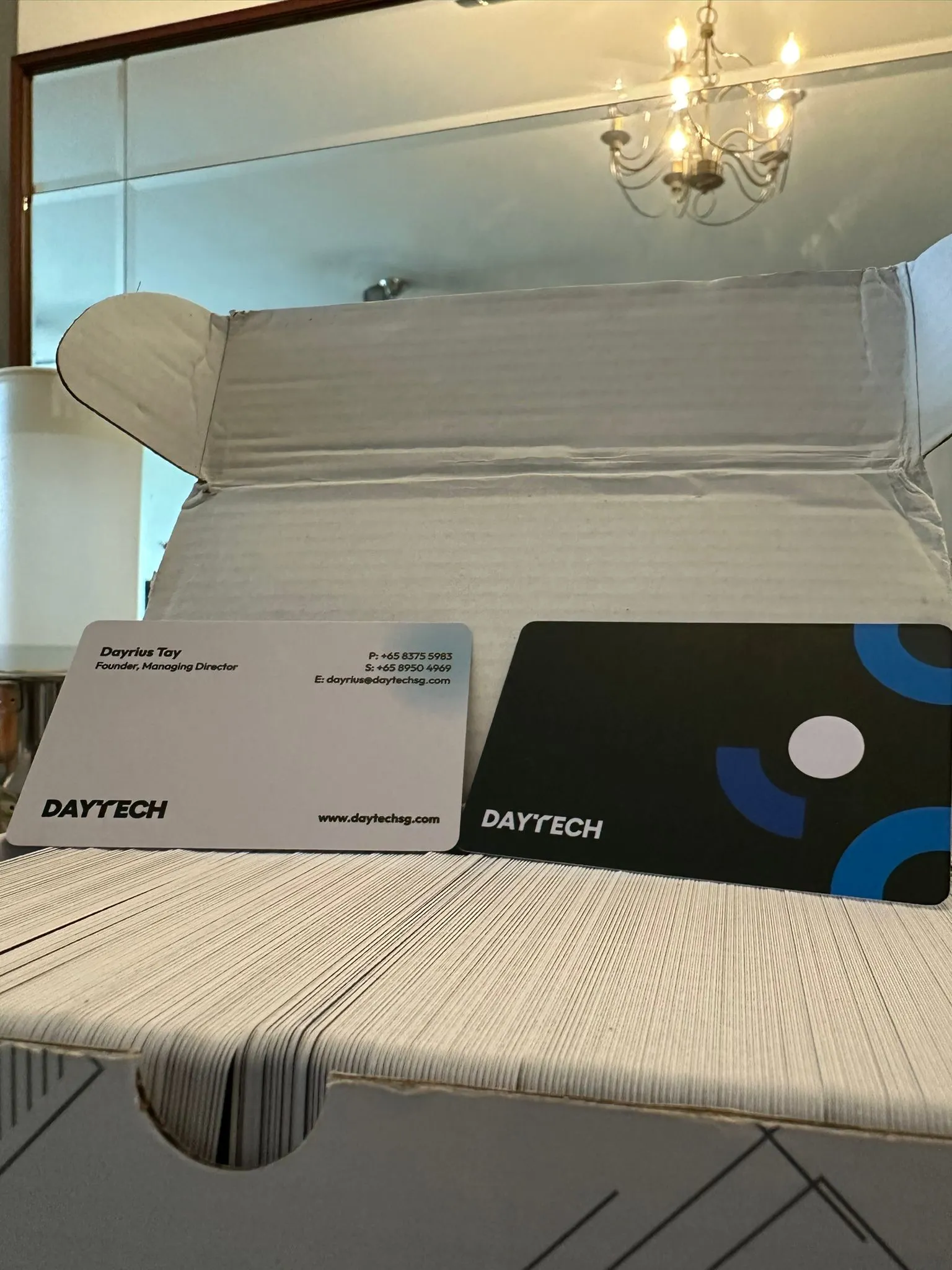 Photo of printed DayTech’s business cards sent by Dayrius.