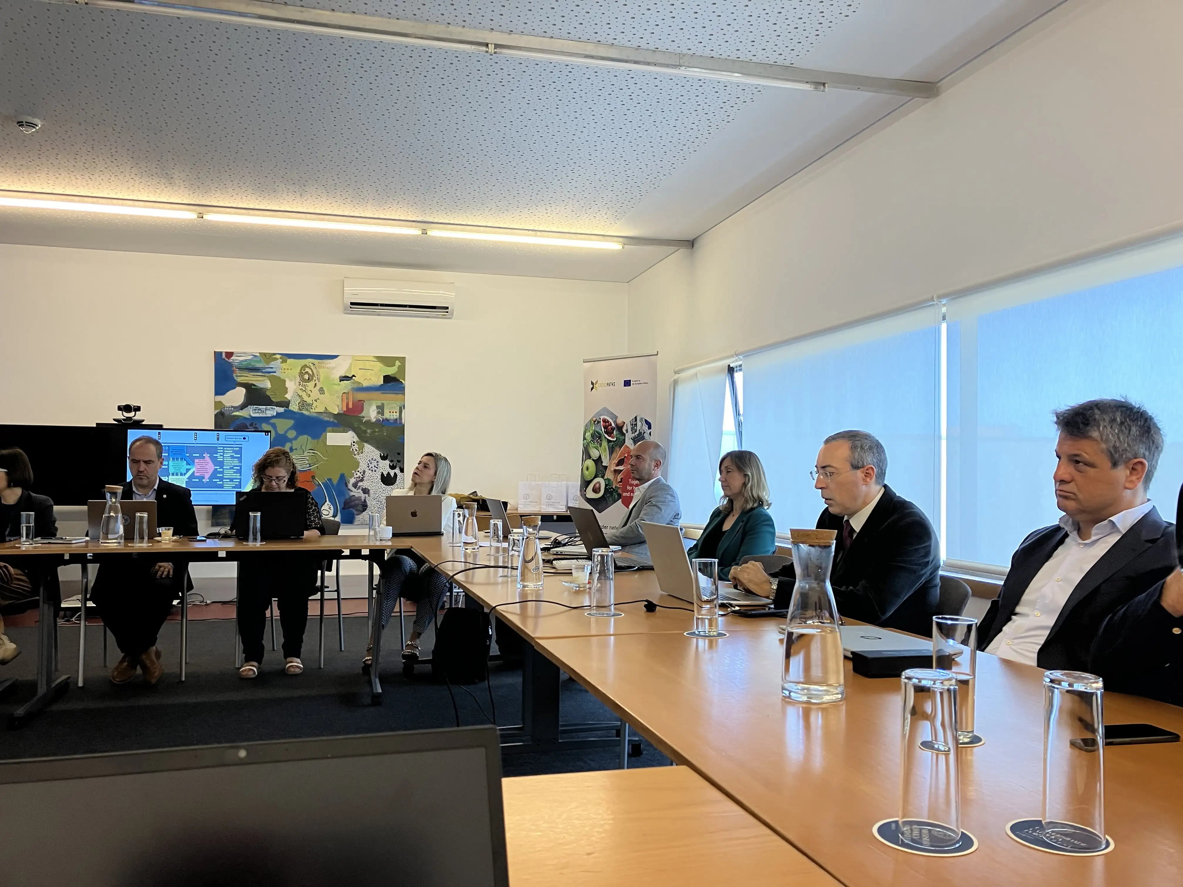 Crosspaths group in a meeting room
